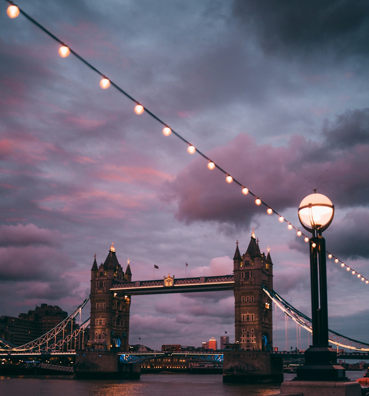 brown bridge under cloudy sky during daytime